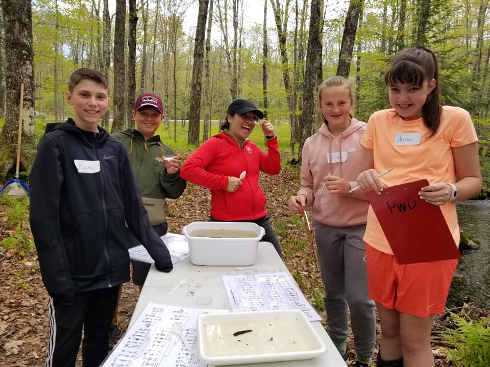 students releasing a trout